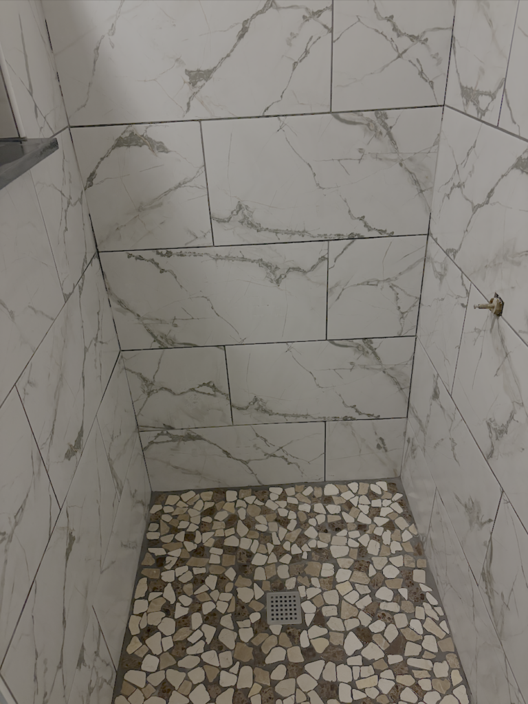 Shower with river rock floor