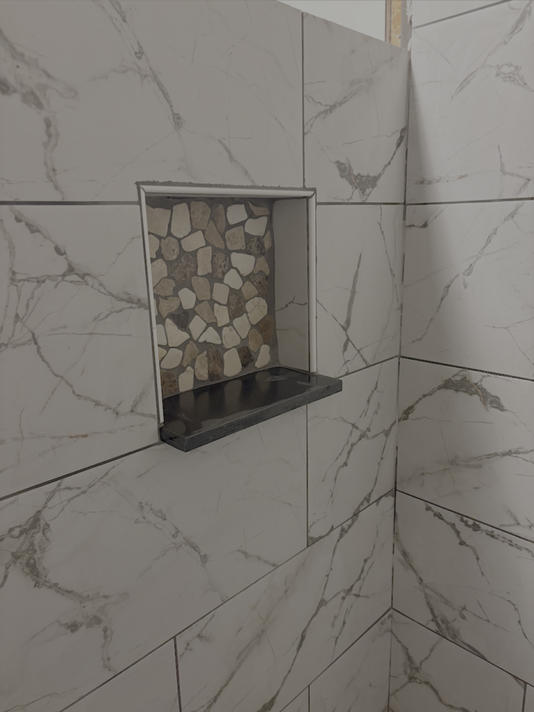 Shower with granite niche shelf